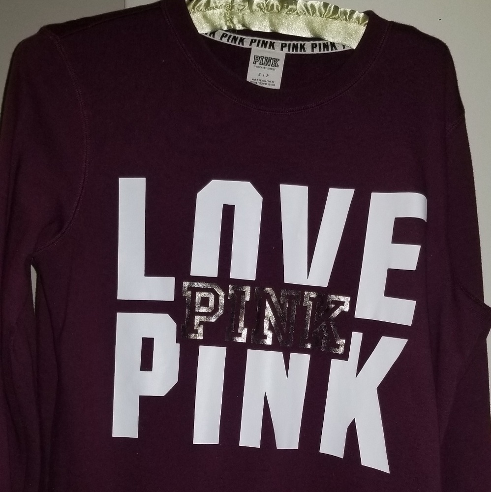 Pink sweat shirt. Maroon size small